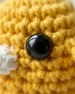 A small crocheted bird the color of the sun - Image 4