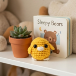 A small crocheted bird the color of the sun