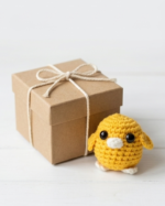A small crocheted bird the color of the sun - Image 3